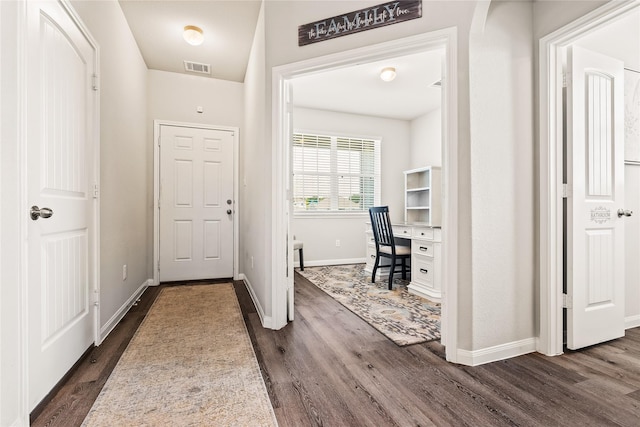 foyer entrance with dark hardwood / wood-style floors