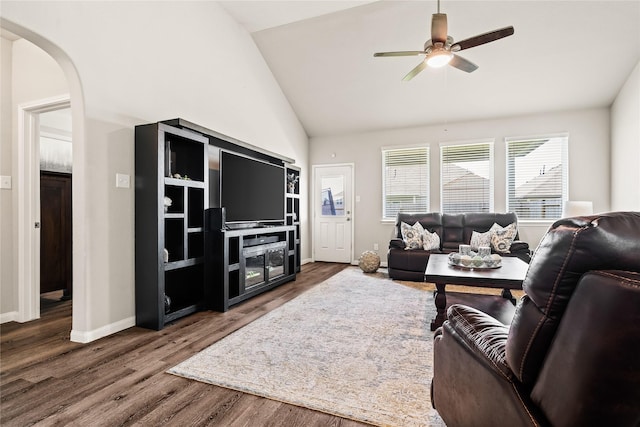 living room featuring hardwood / wood-style flooring, ceiling fan, and high vaulted ceiling