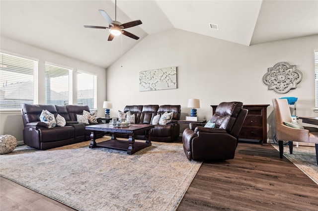 living room featuring lofted ceiling, ceiling fan, and dark wood-type flooring