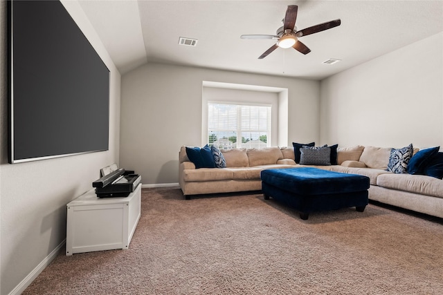 carpeted living room with ceiling fan and lofted ceiling