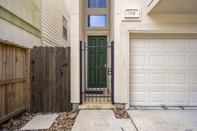 entrance to property featuring a garage