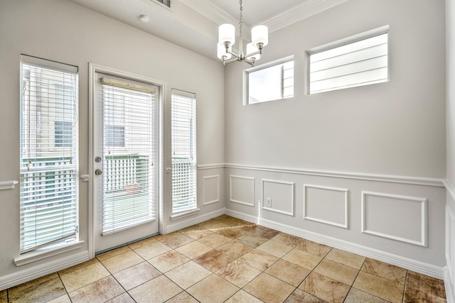 interior space with ornamental molding and a notable chandelier