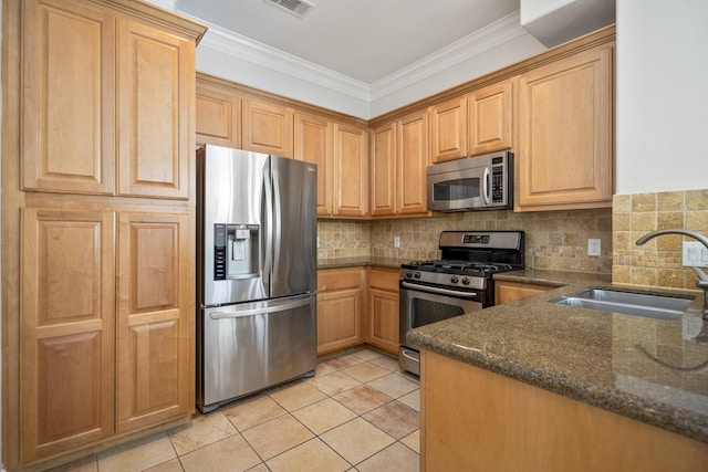 kitchen with sink, decorative backsplash, ornamental molding, and stainless steel appliances