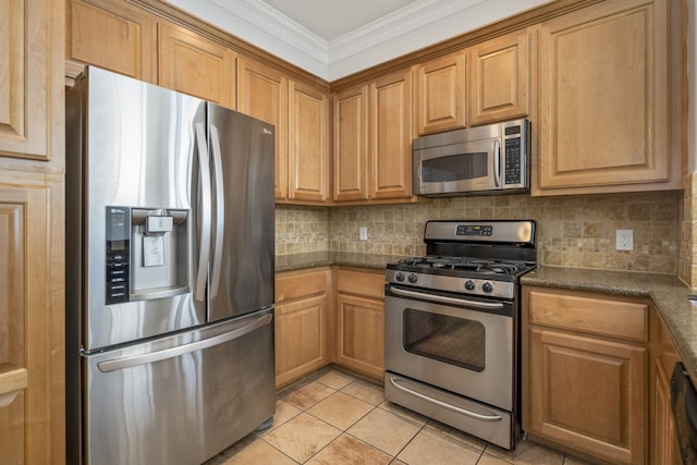 kitchen with appliances with stainless steel finishes, tasteful backsplash, ornamental molding, light tile patterned flooring, and dark stone counters