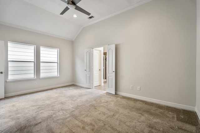 unfurnished bedroom featuring vaulted ceiling, ornamental molding, light carpet, and ceiling fan