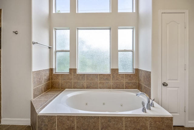 bathroom with tiled tub