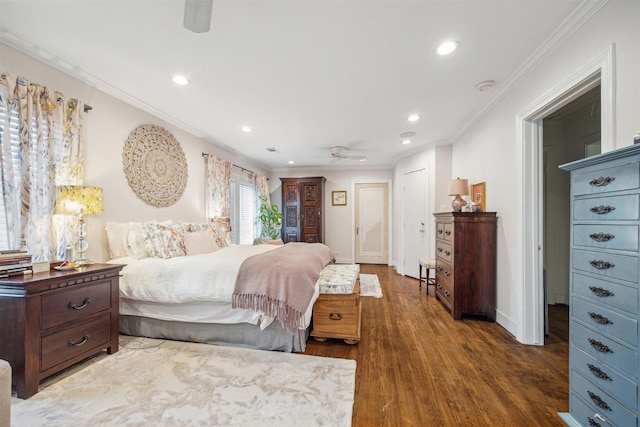 bedroom with crown molding, dark hardwood / wood-style flooring, and ceiling fan