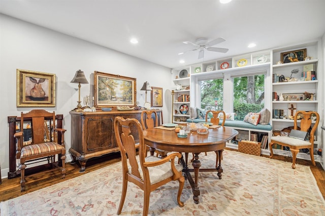 dining area featuring hardwood / wood-style flooring and ceiling fan