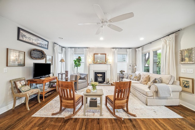 living room with dark hardwood / wood-style floors and ceiling fan