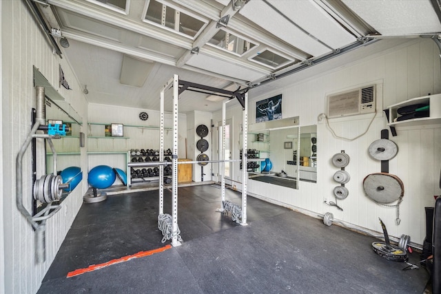 workout area featuring a wall unit AC