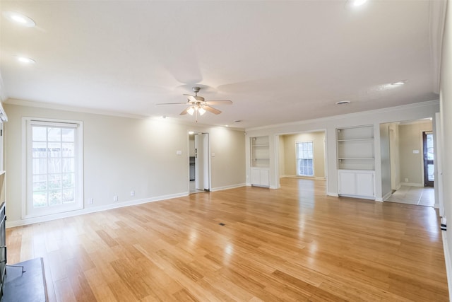 unfurnished living room with ceiling fan, light hardwood / wood-style flooring, built in features, and ornamental molding