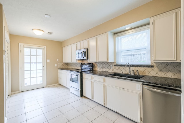 kitchen with white cabinetry, sink, plenty of natural light, and appliances with stainless steel finishes