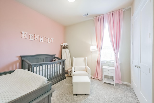 bedroom featuring light colored carpet