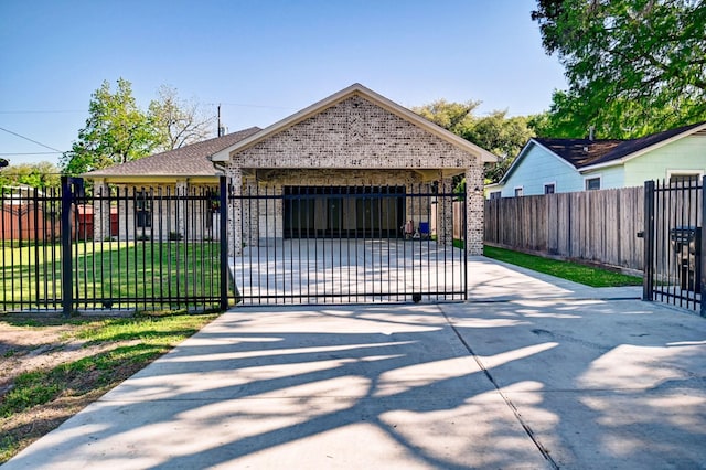 view of gate featuring a yard