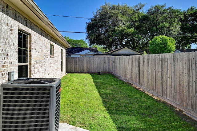 view of yard with central air condition unit