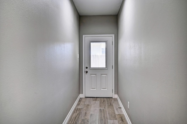 doorway with light hardwood / wood-style floors