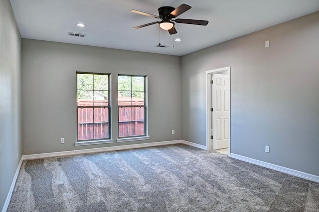 unfurnished room with ceiling fan and carpet flooring