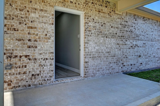 property entrance with a patio area