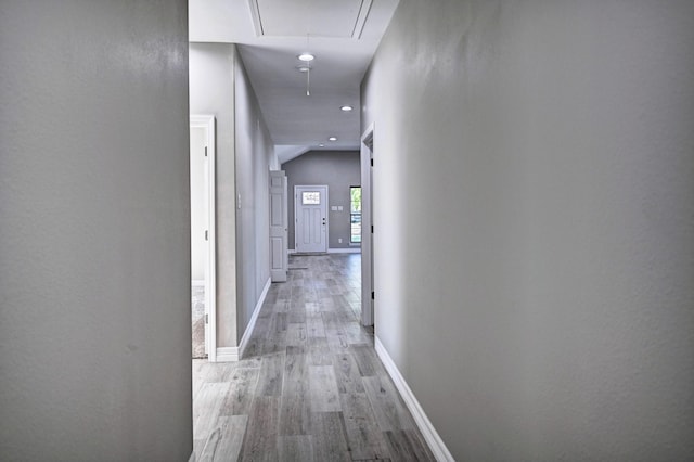 corridor featuring light hardwood / wood-style floors