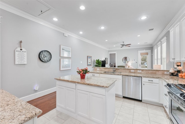 kitchen with crown molding, white cabinetry, sink, and stainless steel appliances