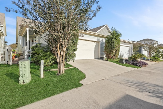 view of front of home featuring a garage and a front yard