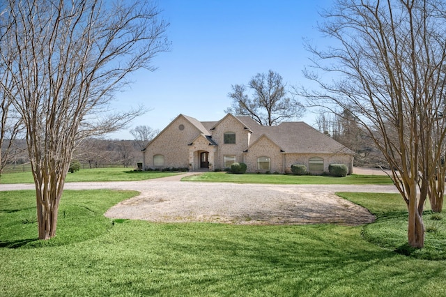 french provincial home featuring a front lawn