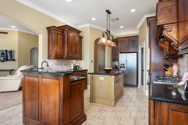 kitchen featuring stainless steel refrigerator with ice dispenser, backsplash, kitchen peninsula, a kitchen island, and ornamental molding