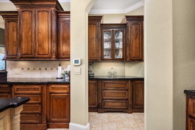 bar featuring decorative backsplash and ornamental molding