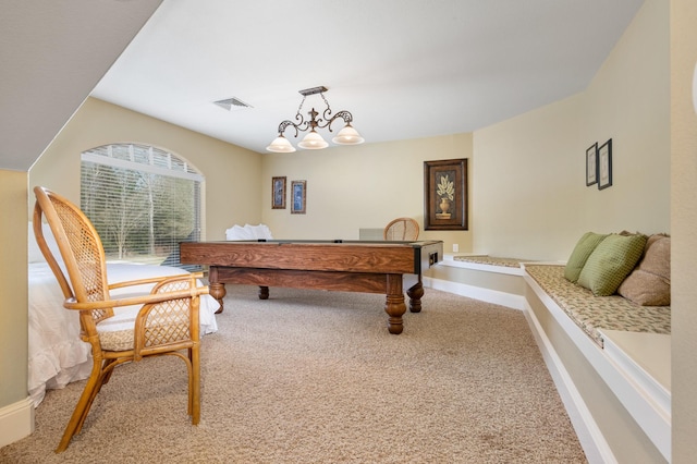 recreation room with carpet and a chandelier