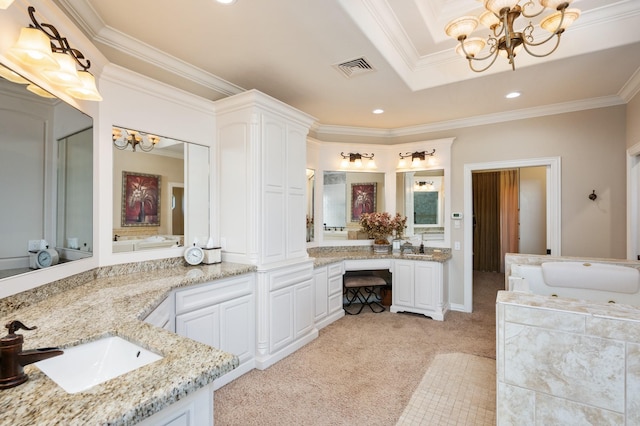 bathroom featuring a bathing tub, vanity, a chandelier, and ornamental molding