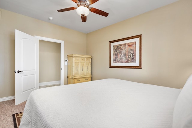 bedroom featuring ceiling fan and carpet