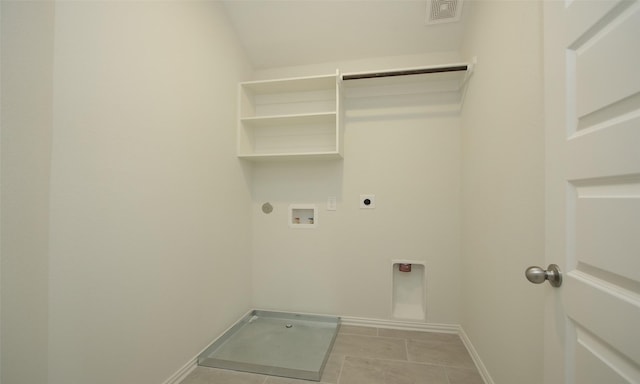 washroom featuring washer hookup, hookup for a gas dryer, light tile patterned floors, and electric dryer hookup