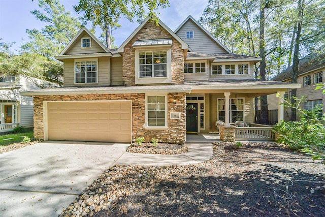 craftsman-style home featuring a porch and a garage