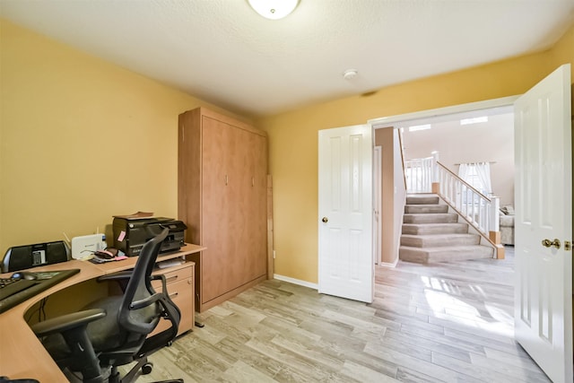 office with light hardwood / wood-style floors