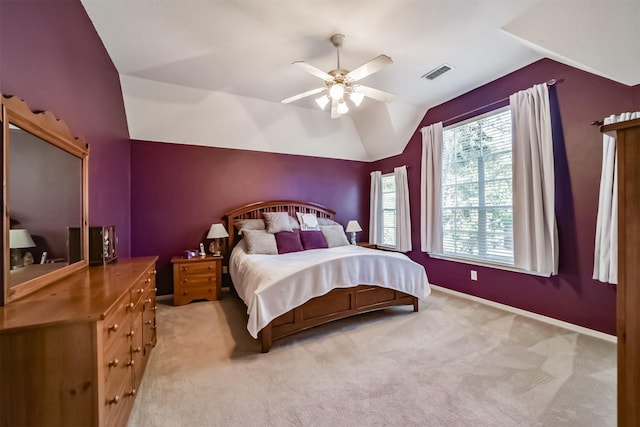 carpeted bedroom featuring ceiling fan and vaulted ceiling