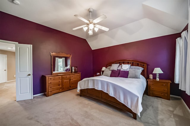 carpeted bedroom featuring ceiling fan and lofted ceiling