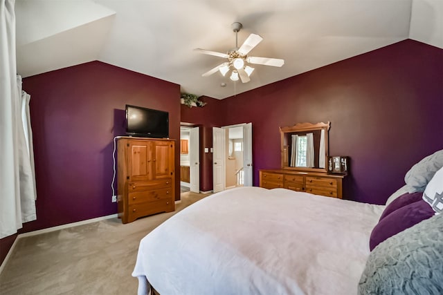 carpeted bedroom featuring ceiling fan and lofted ceiling