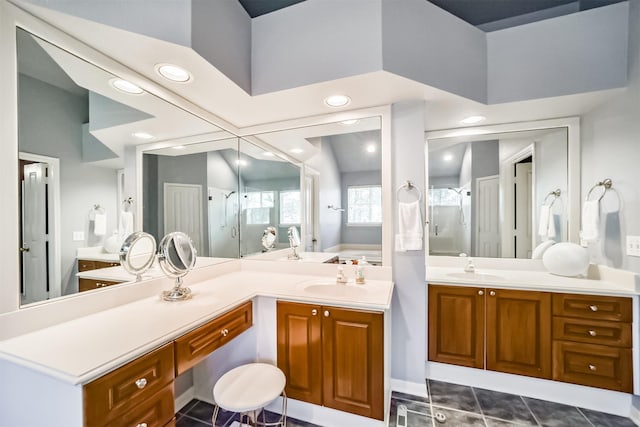 bathroom with tile patterned floors, vanity, and separate shower and tub