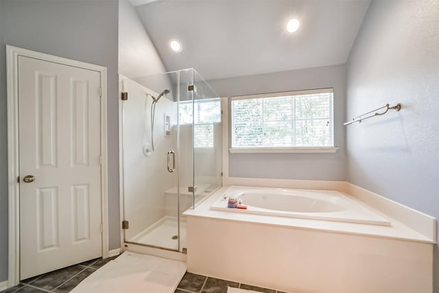 bathroom featuring tile patterned flooring, lofted ceiling, and independent shower and bath