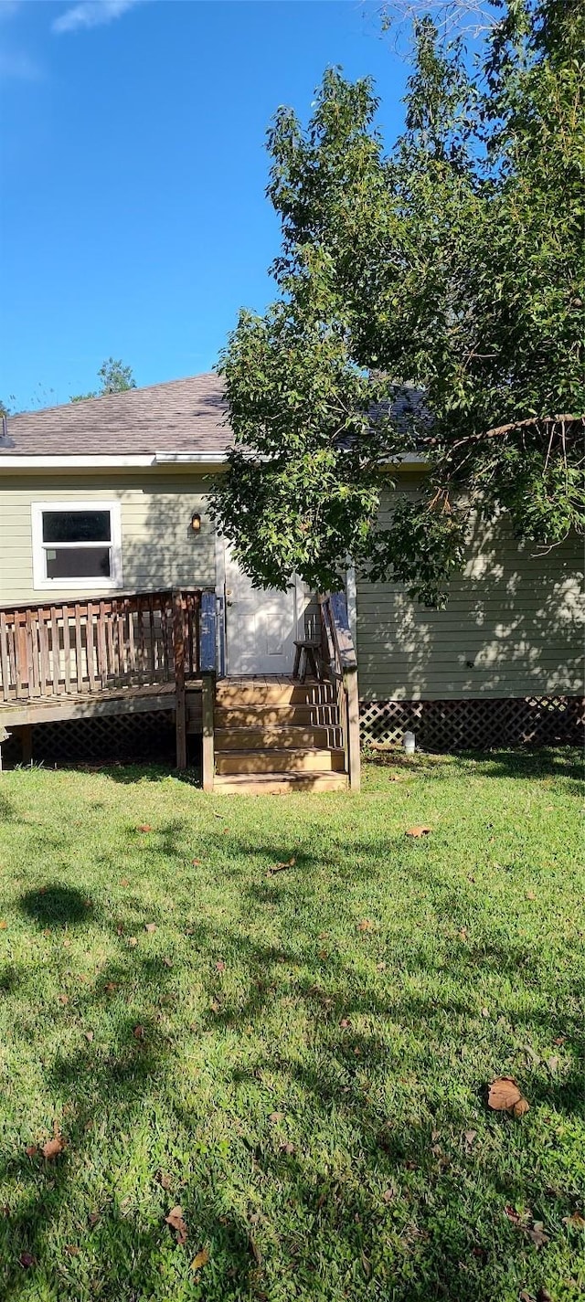 view of yard featuring a wooden deck