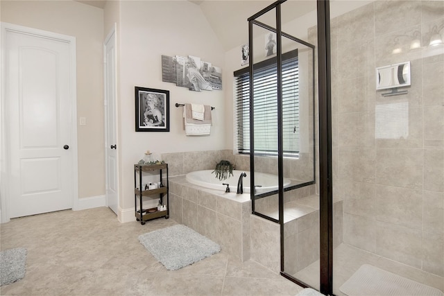 bathroom with independent shower and bath and lofted ceiling