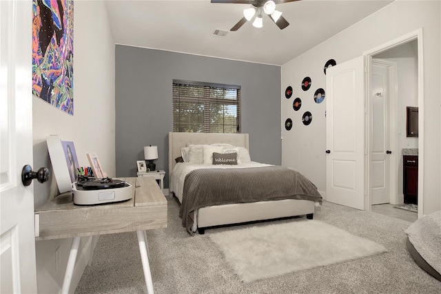 bedroom with light carpet and ceiling fan