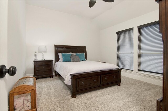 bedroom featuring light carpet and ceiling fan