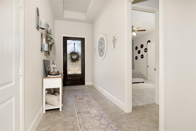 entrance foyer featuring ceiling fan