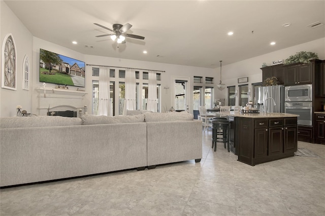 living room featuring ceiling fan