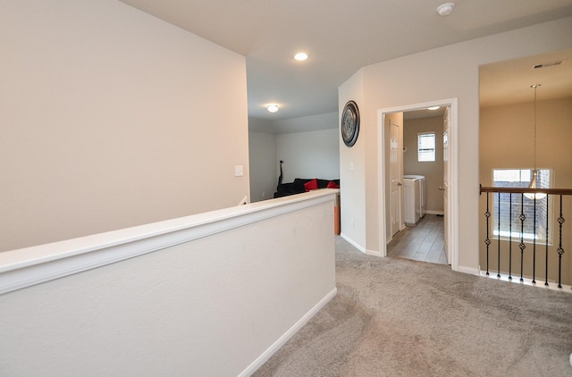 hallway with light carpet