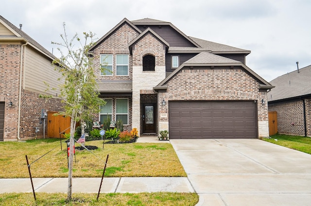 view of front of home with a garage and a front yard