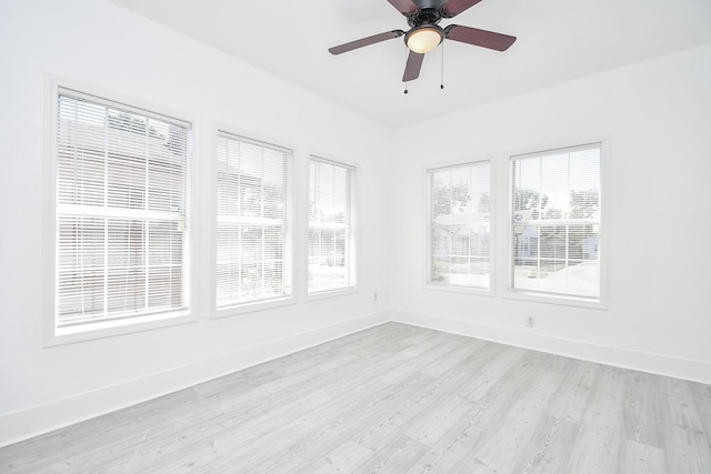 unfurnished sunroom with ceiling fan and a wealth of natural light