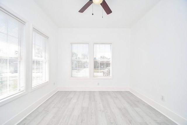 spare room featuring light wood-type flooring and ceiling fan