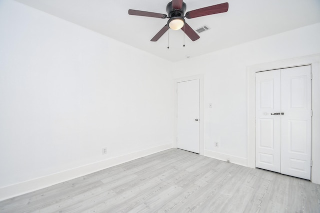 unfurnished bedroom featuring ceiling fan and light wood-type flooring